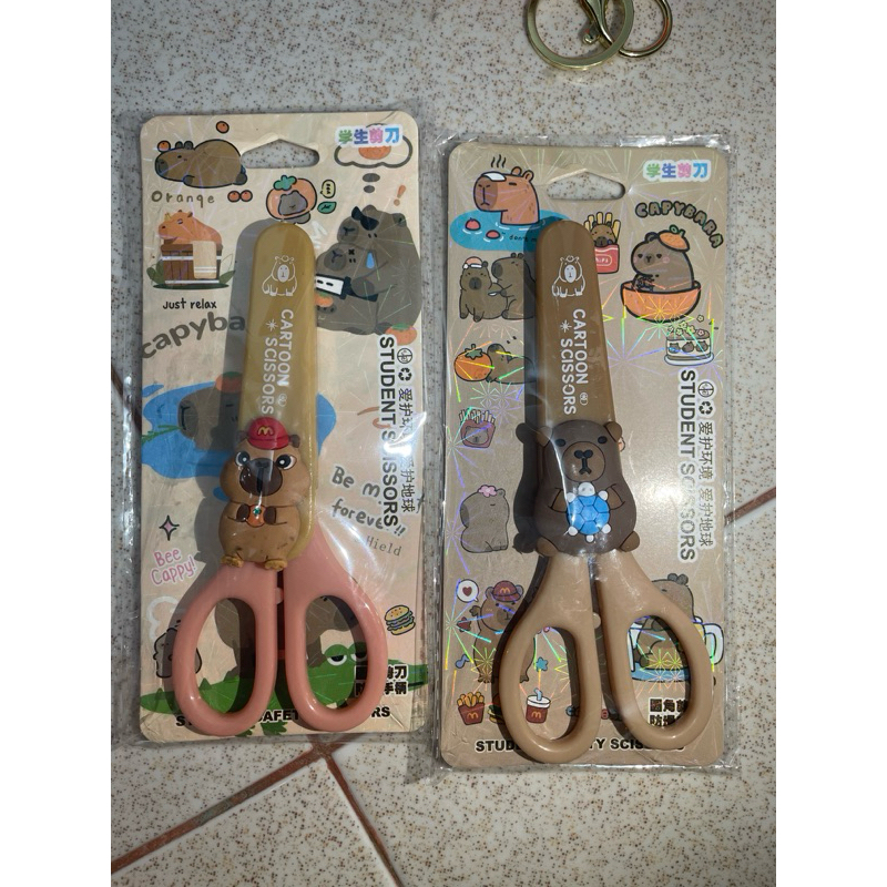 

Gunting tutup capy bara