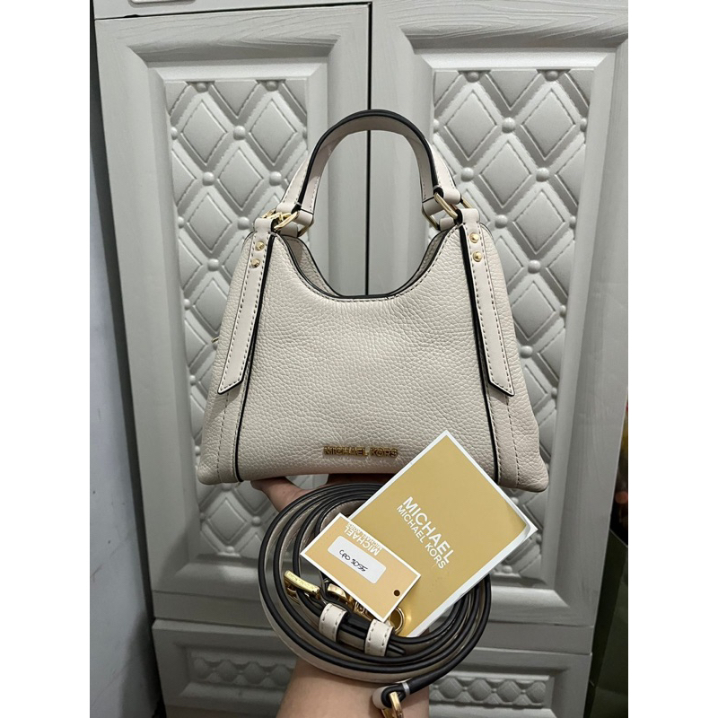 MK Arlo leather small cross light cream