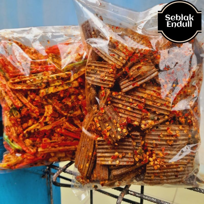 

SEBLAK KERING KERUPUK JENGKOL PEDAS DAUN JERUK KEMASAN 200 GR