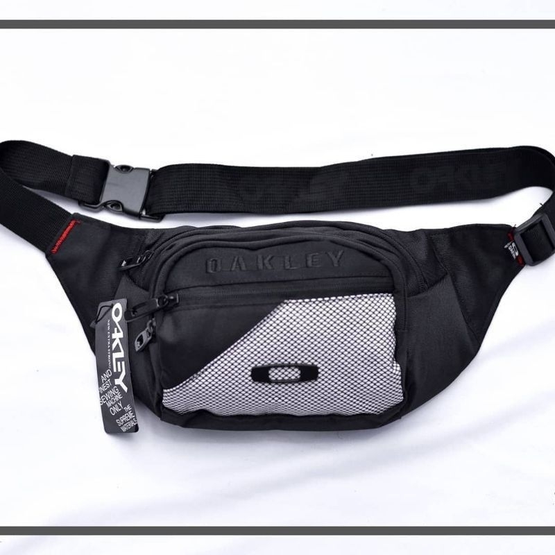 TAS OAKLEY TAS SELEMPANG OAKLEY WAISTBAG OAKLEY SLINGBAG OAKLEY TAS PINGGANG PRIA LOGO BESI