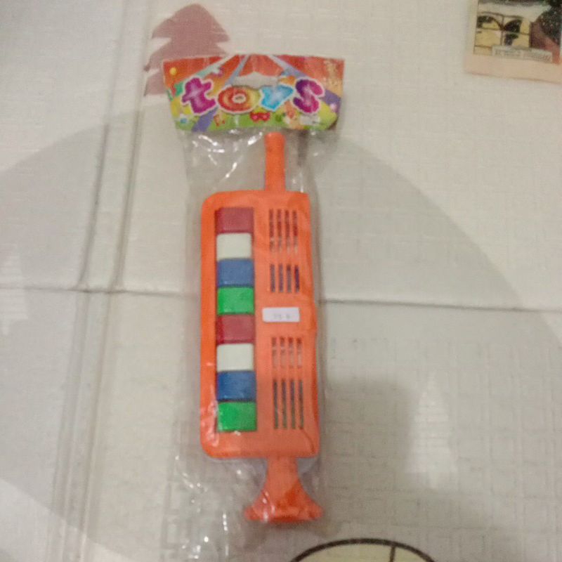 mainan anak piano tiup