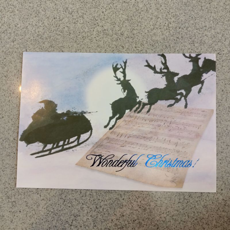 Kartu ucapan Natal Christmas greetings card seasons greetings motif Santa kereta rusa note musik