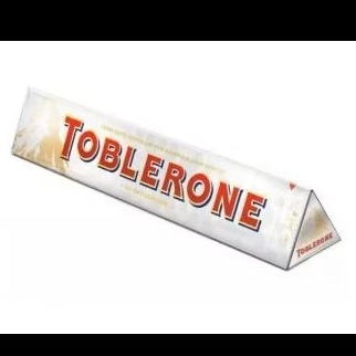 

Toblerone White Chocolate With Honey & Almond Kougat Big Size