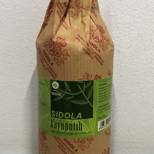 Sidola KAYU PUTIH UKURAN 300 ML DAN 640 ML Kemasan Botol KACA HANGAT SETIAP SAAT NYAMAN DI KULIT