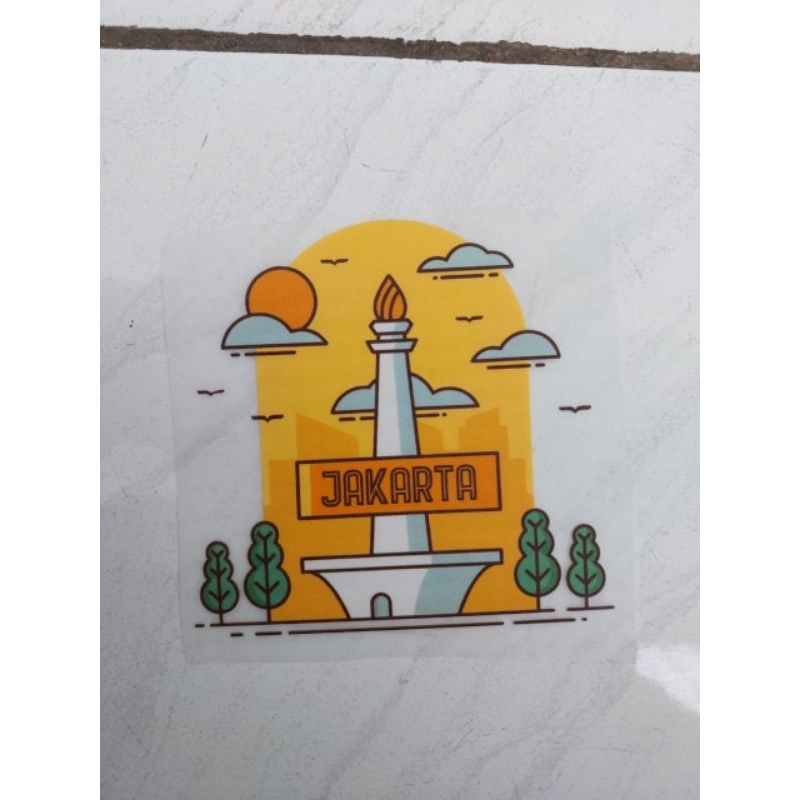 

STICKER DTF GOSOK LOGO MONAS Ukuran L 9cm P 12 cm