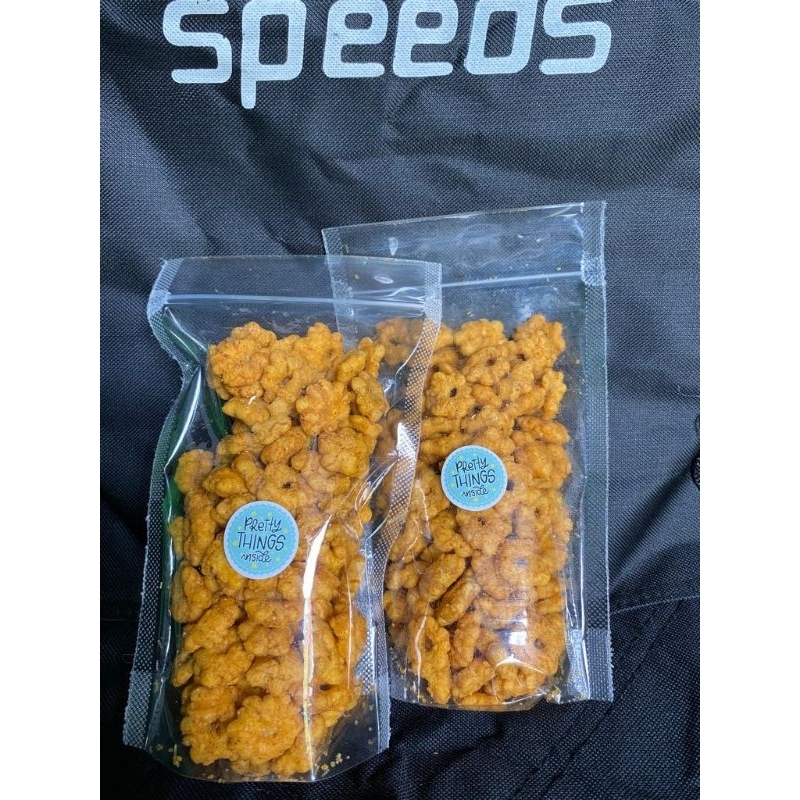 

snack SAKURA (pang pang) dengan bumbu yang melimpah gurih asin kemasan 100gram