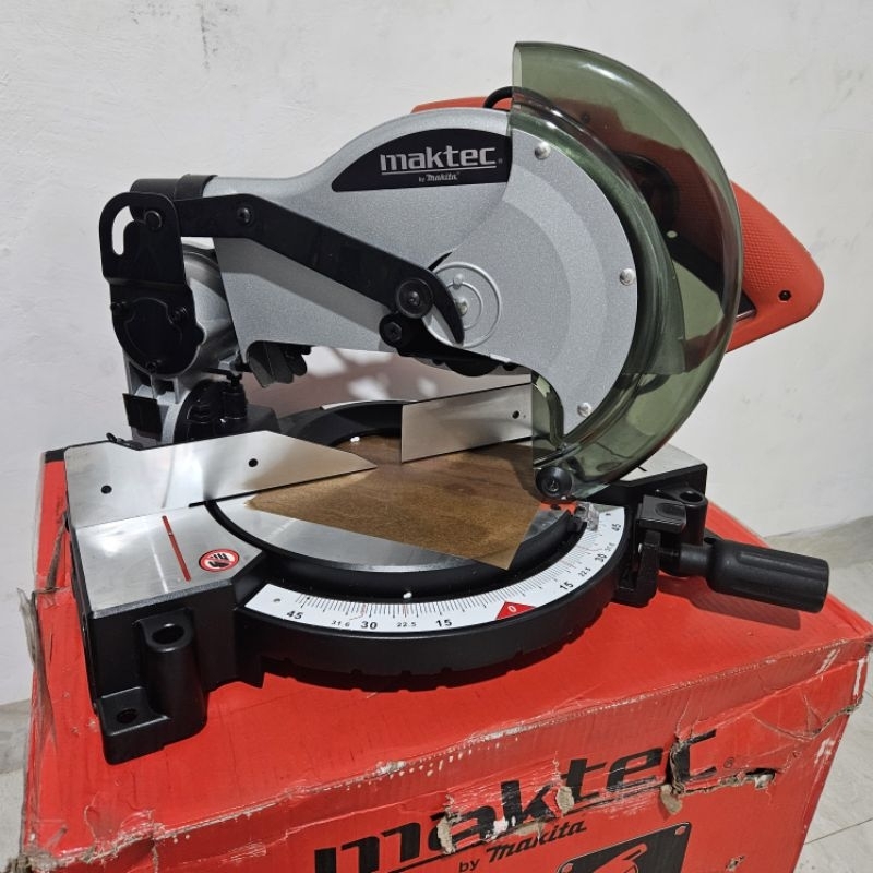 Mesin Gergaji Duduk Potong Kayu Aluminium Maktec MT230 Compound Miter Saw 255mm Putra Inti