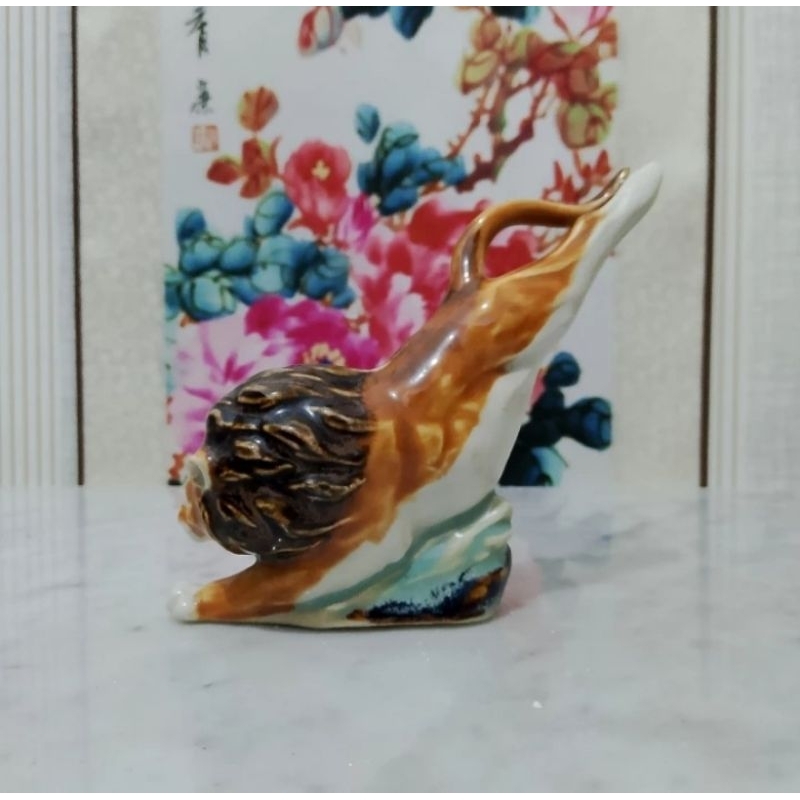 Patung keramik singa pajangan antik