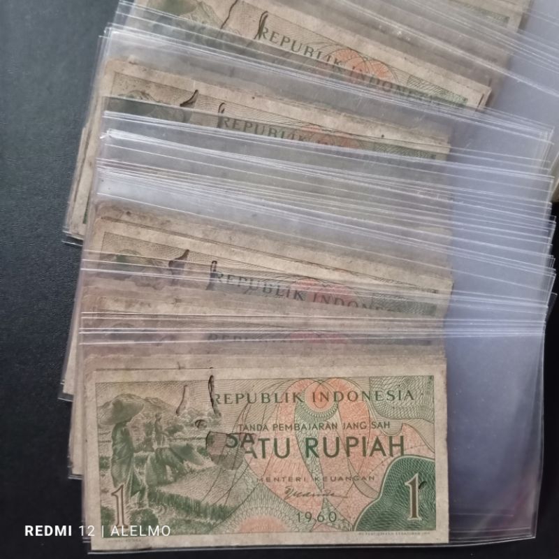 uang kertas 1 rupiah seri sandang pangan bekas jelek