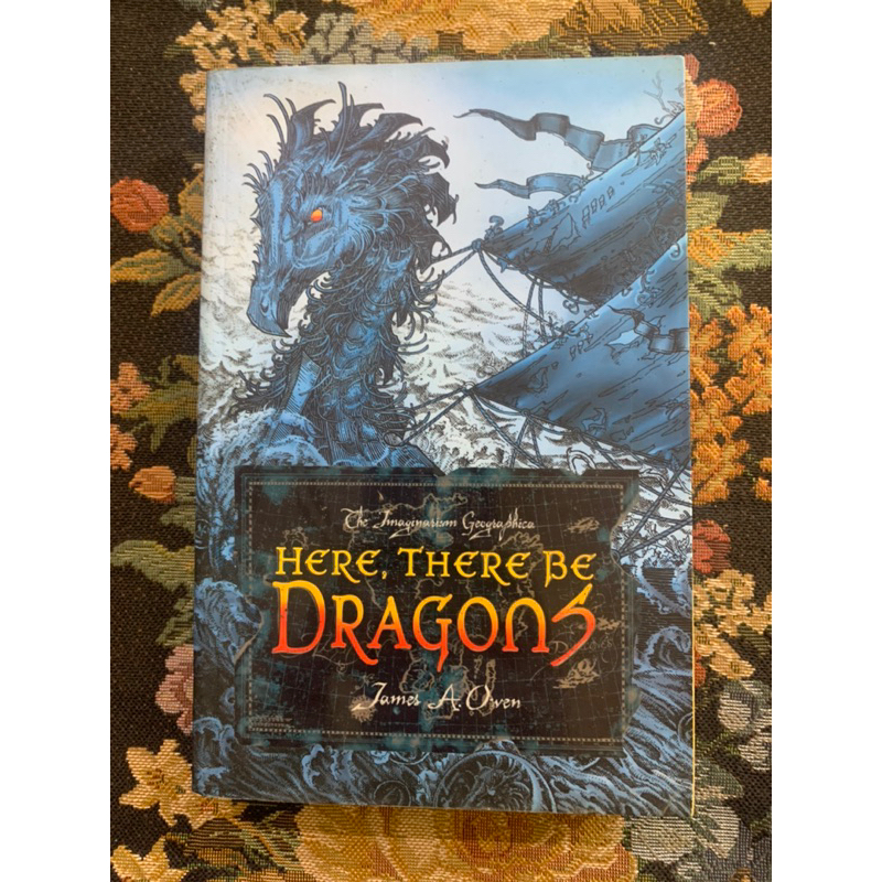 Novel fantasi here there be dragon by James a owen
