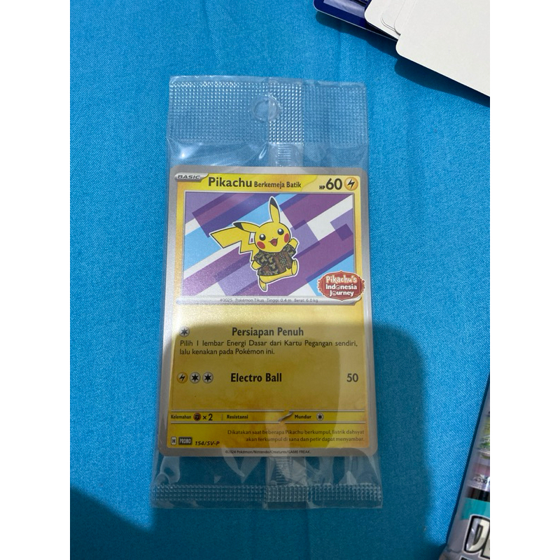 Kartu pokemon pikachu kemeja batik ungu