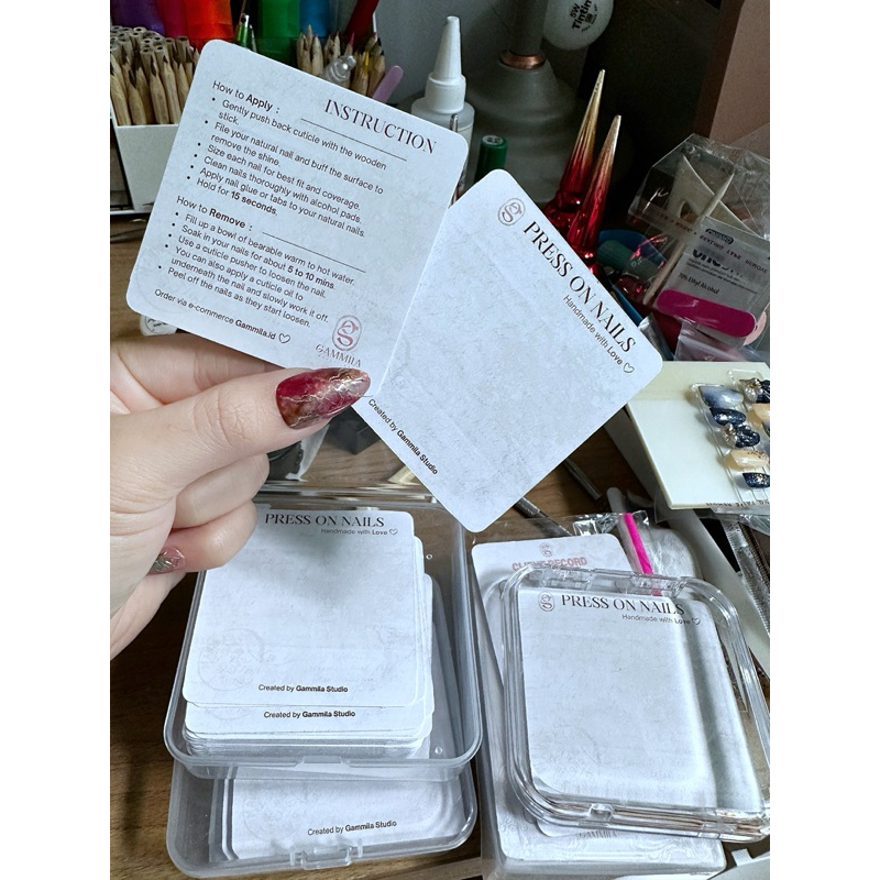 Jasa design kertas aftercare , loyalti card dan press on nails