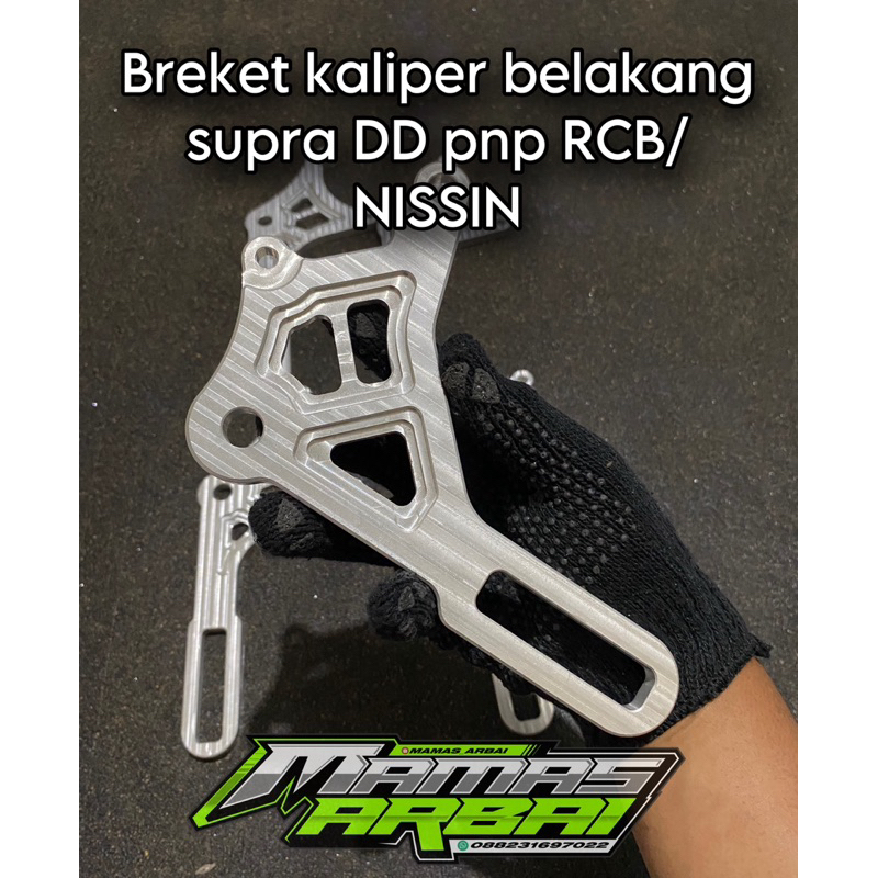 BREKET KALIPER BELAKANG SUPRA X 125 DD PNP RCB NISSIN