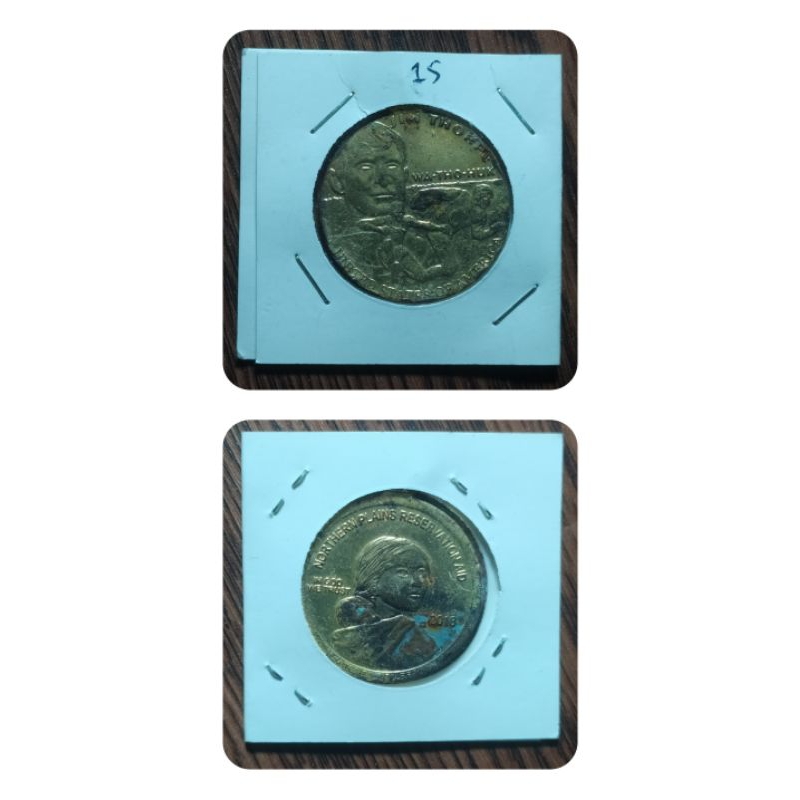 gantungan kunci in god we trust kondisi bekas