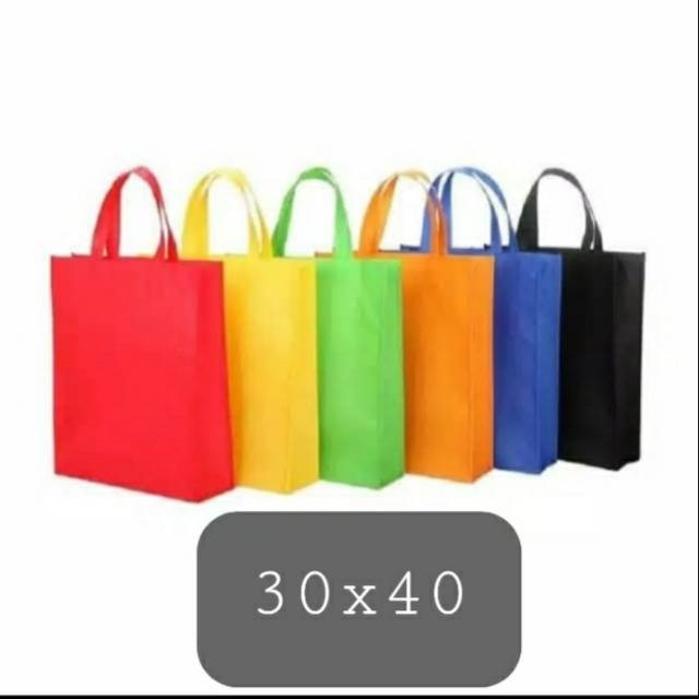 

GROSIR TAS SPUNBOND COMICO UK. 30 CM X 40 CM POLOS (1 LUSIN ISI 12)