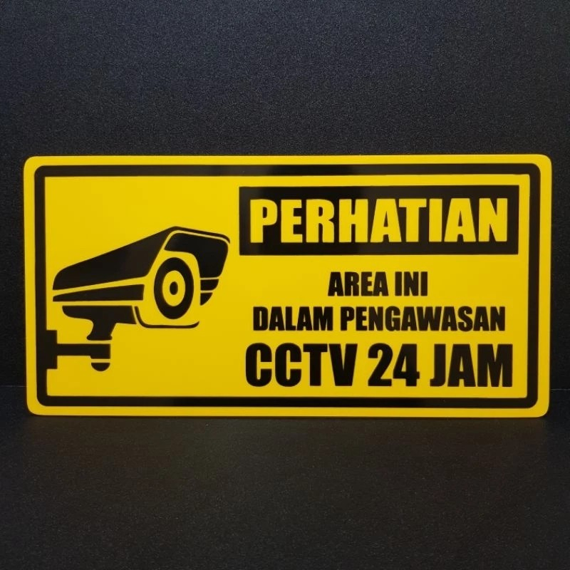 

Papan akrilik tulisan AREA INI DALAM PENGAWASAN CCTV 24JAM