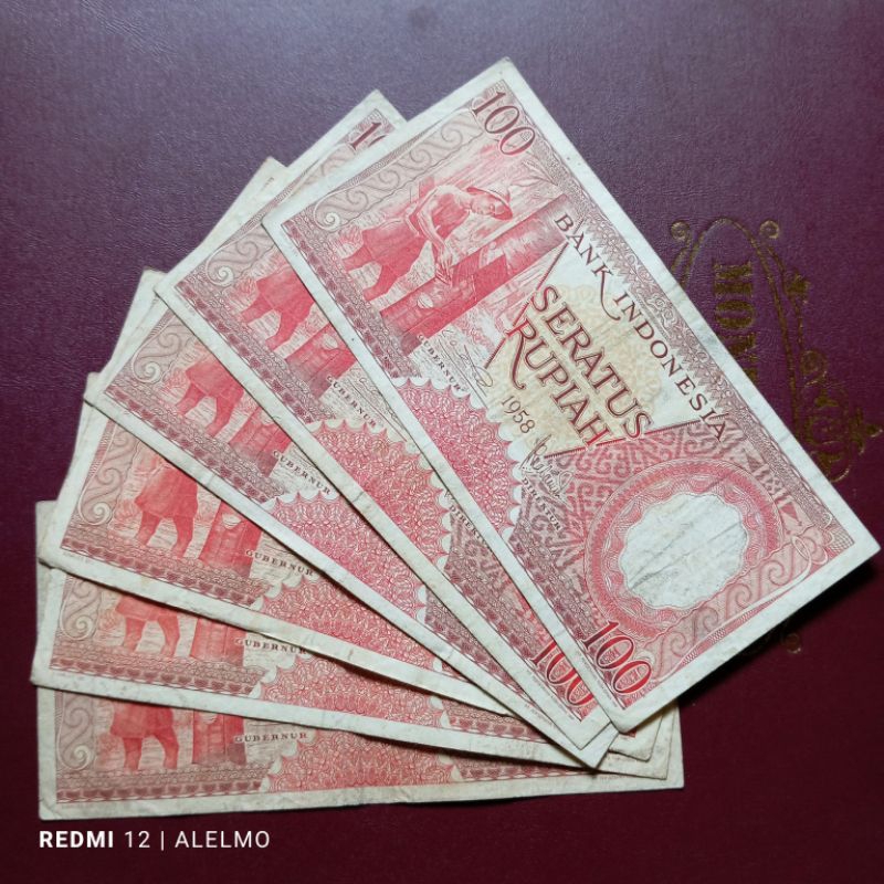 100 rupiah seri pekerja bekas