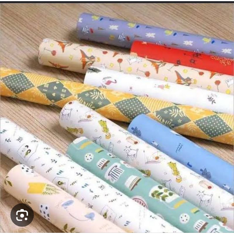 

RB ( 1 Pack ) Kertas Kado Sinar Dunia Isi 50 Lembar