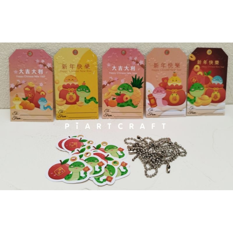 

10 pcs (dapat 5 desain tag + ornament + rantai) Hangtag Chinese New Year Imlek Sincia Snake Label Tag Parcel Kado