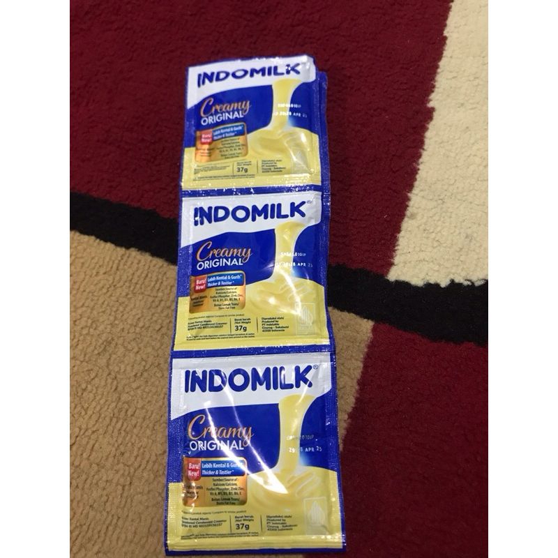 

Indomilk Creamy Original-SUSU INDOMILK kental manis renceng isi 6 sachet