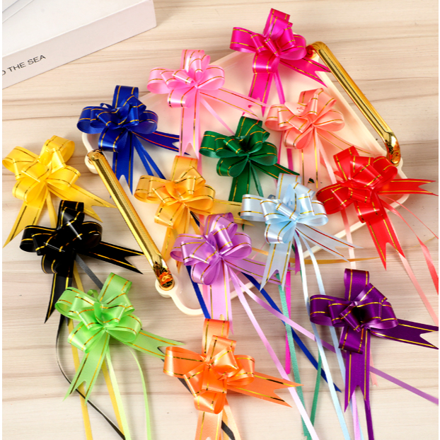 

MG (1300PC = 1KG) PB 094 PITA TARIK LIS EMAS UKURAN SEDANG (18mm) PARCEL SOUVENIR PULL FLOWER RIBBON