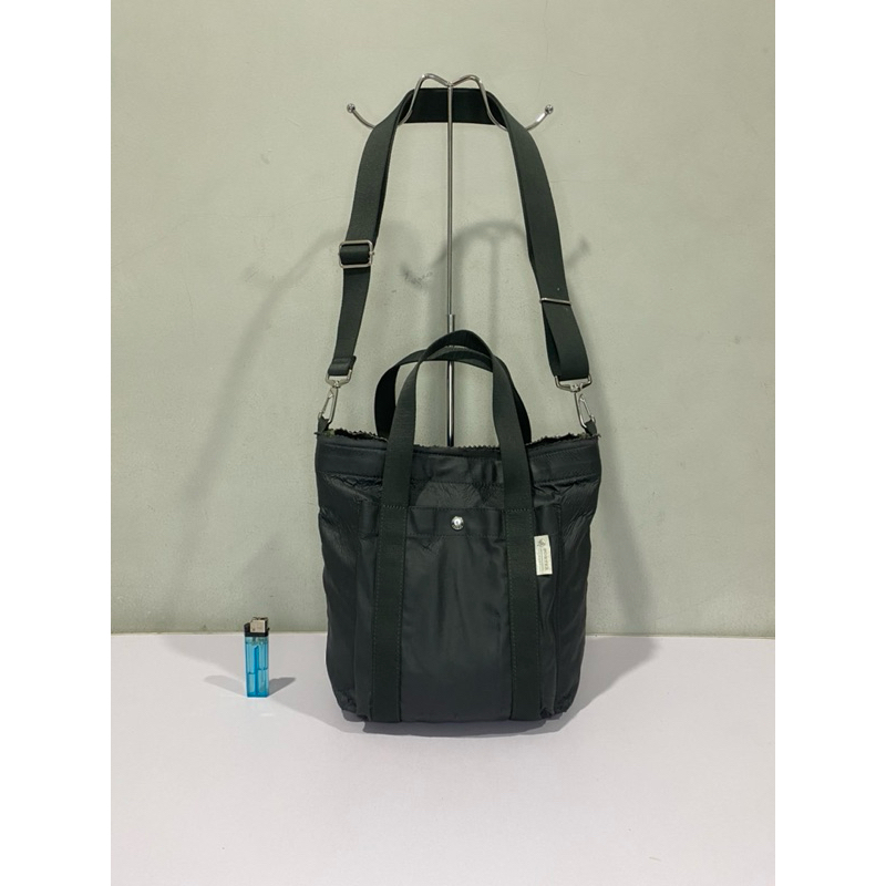 tas sling porter internasional