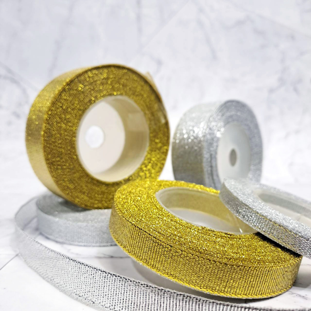 

Pita Metalik Emas Silver Cloth Riboon Metalic Silver & Gold 6mm, 12mm, 24mm Panjang 18 Meter - CLM6, CLM12, CLM24