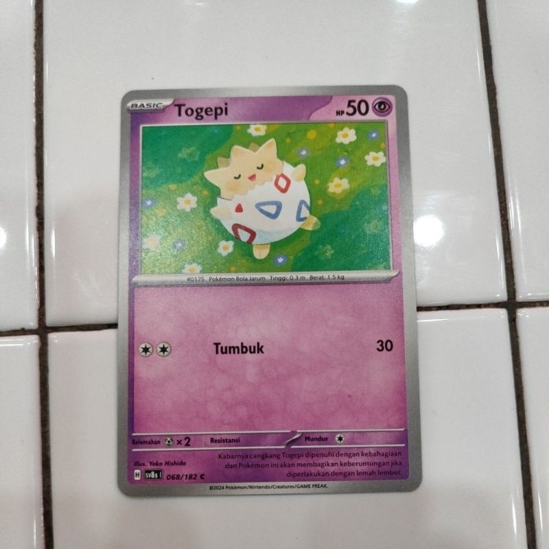 kartu pokemon. kilat rasi. game kartu koleksi pokemon. togepi
