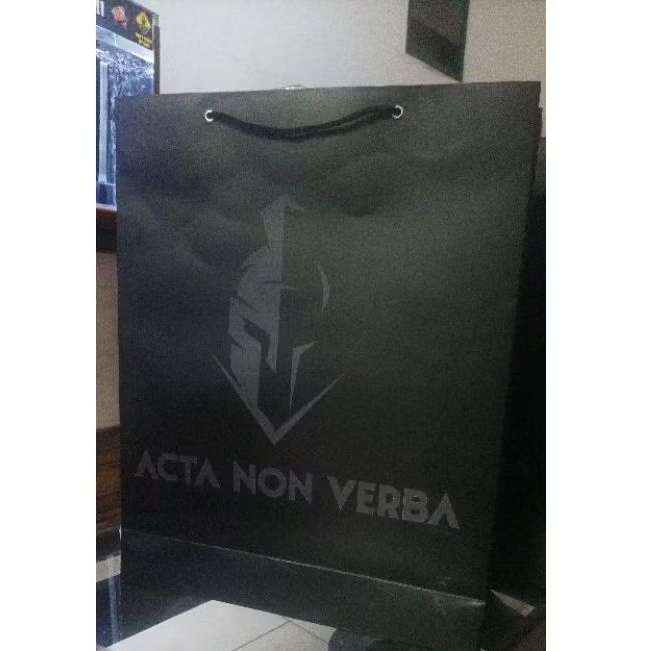 

Paper bag hitam logo Acta Non Verba