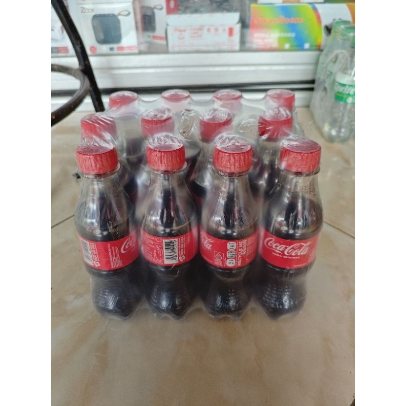 

Coca Cola Botol 250ml