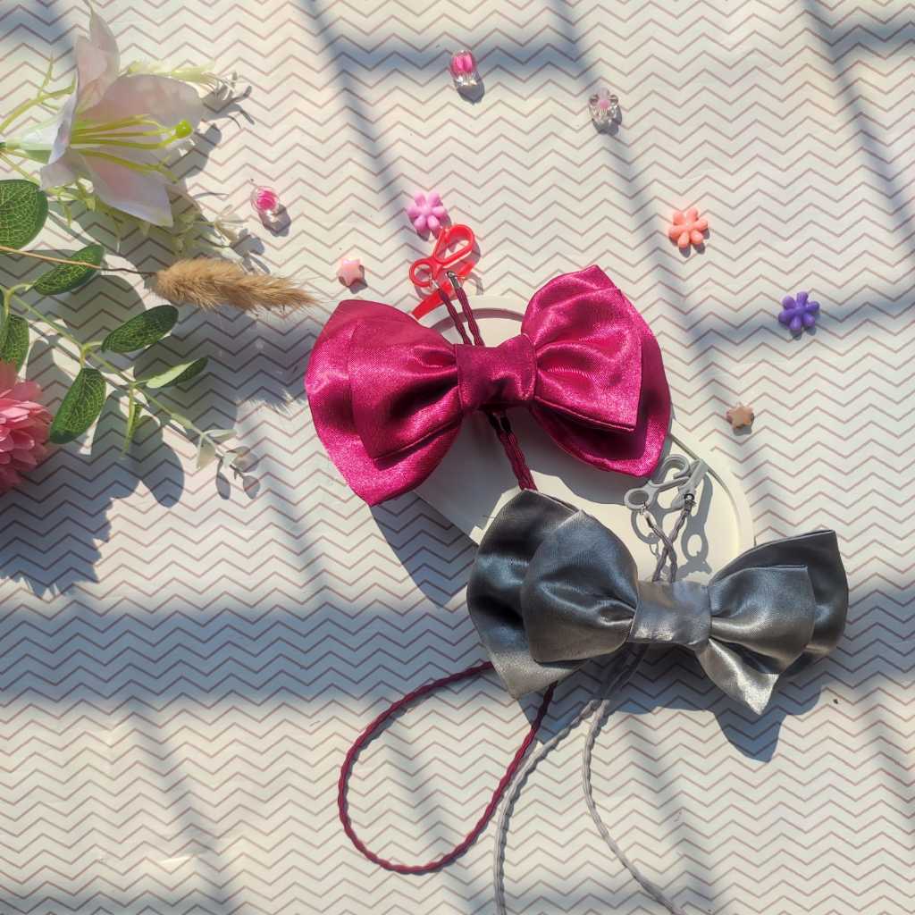 conector masker hijab dengan aksen pita yang cantik