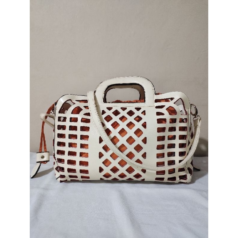 Laser cut top handle bag