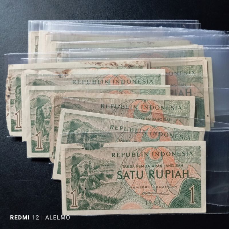 uang kertas 1 rupiah seri sandang pangan bekas jelek