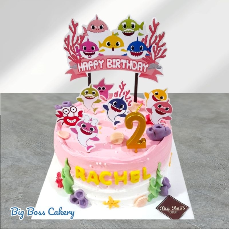 

BABY SHARK PINK GIRL BUTTERCREAM CAKE WITH PRINTED TOPPER