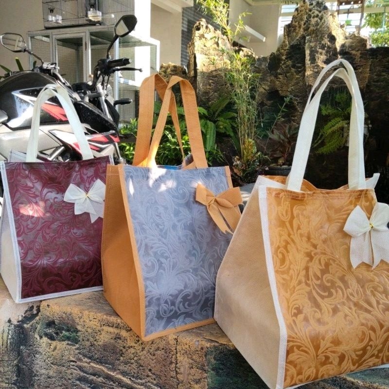 

tas hajatan embos elegan 22 per lusin isi 12 psc