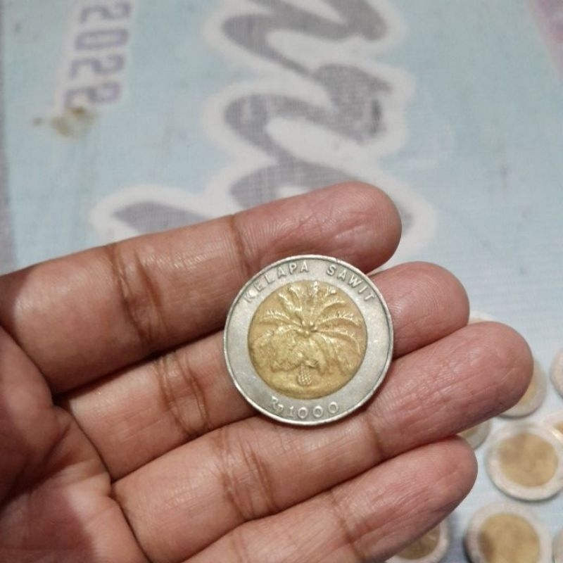 koin Rp.1000 lawas kelapa sawit