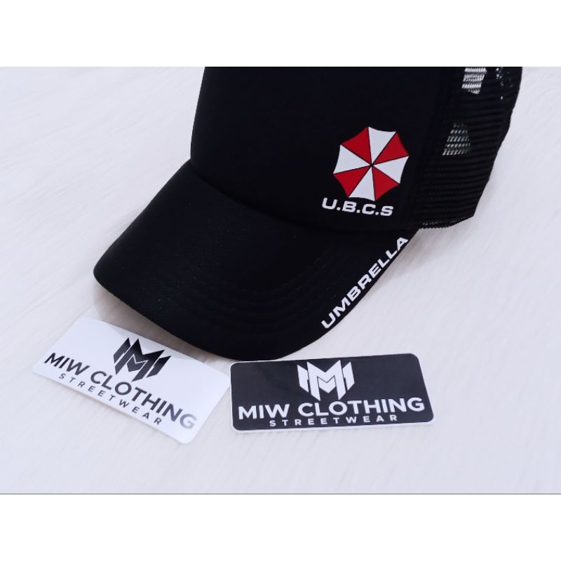 Topi Pria TerlarisTrucker | Topi Jaring Viral UMBRELLA Logo | Topi Umbrella Corporation Logo