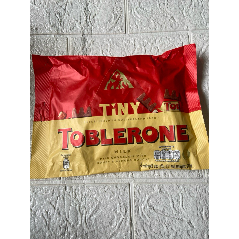 

Toblerone tiny milk chocolate with honey almond nougat import
