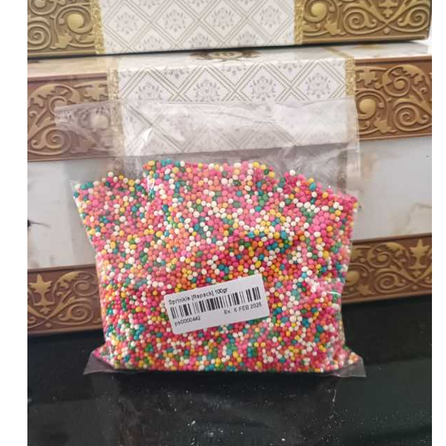 

RAINBOW SPRINKLES (Repack) 100 Gram Warna Warni Sprinkle - Springkel Trimit