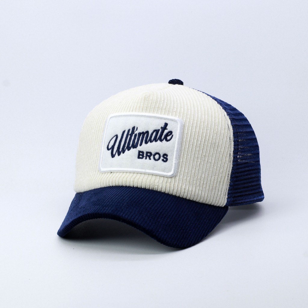 TOPI JARING TRUCKER HAT LIDAH PENDEK BAHAN CORDUROY WARNA NAVY VISOR PENDEK ULTIMATE BROS