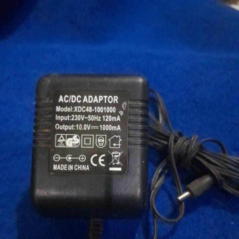 ADAPTOR AC/DC 10.0V-1000mA SESUAI FOTO KONDISI NORMAL