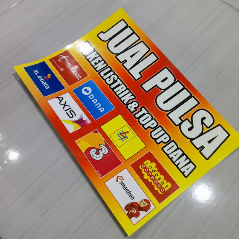 

stiker "JUAL PULSA TOKEN LISTRIK TOP UP E-WALET" Ukuran 20x28 cm Bahn vinyl sudah di Laminasi dingin