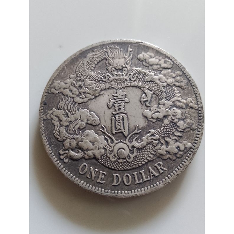 koin china naga one dollar sedang