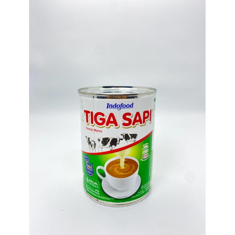 

SKM susu kental manis kaleng tiga sapi /susu tiga sapi