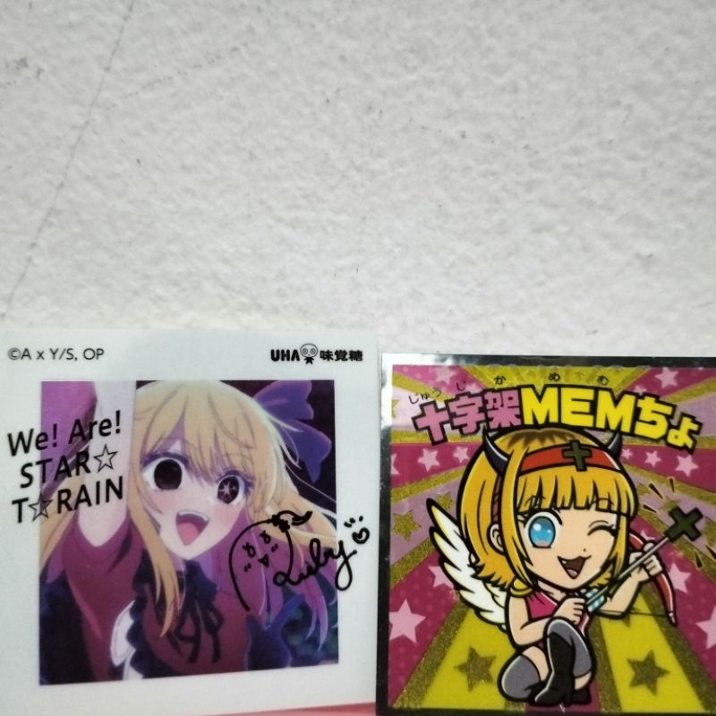 

Mainan/Merchandise Oshi no Ko Manchoco Light Seal Secret Cross MEMcho S2 & Ruby Hoshino