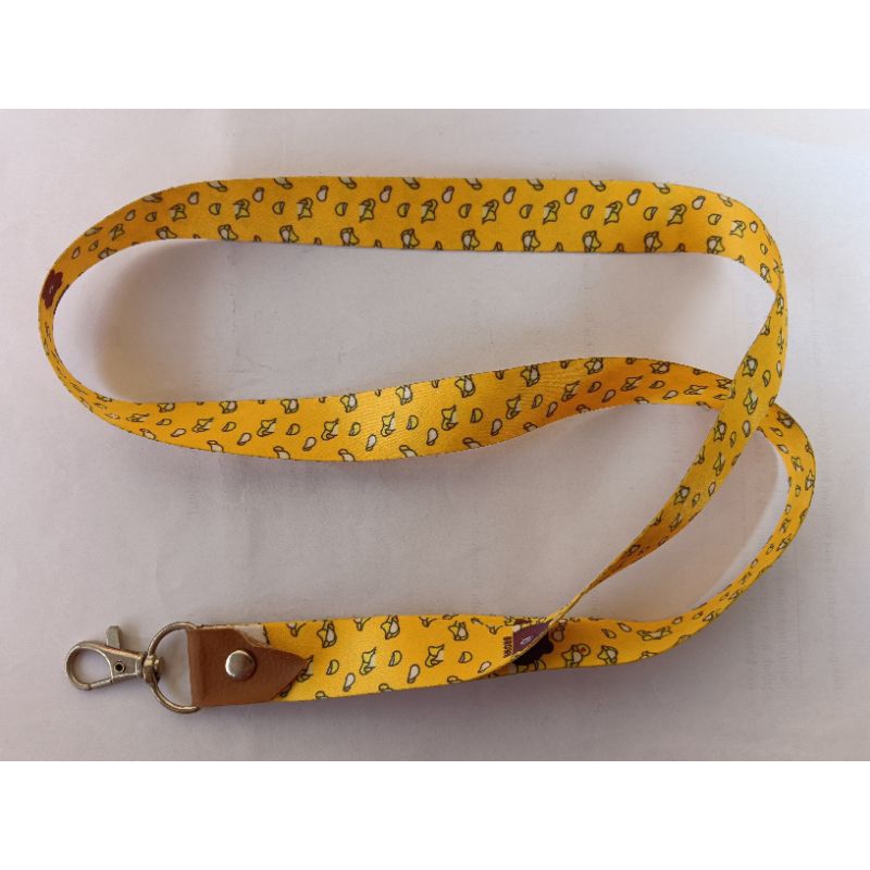 

Tali Lanyard Motif YELLOW BROWN LINE (warna dasar kuning, pinggiran coklat).