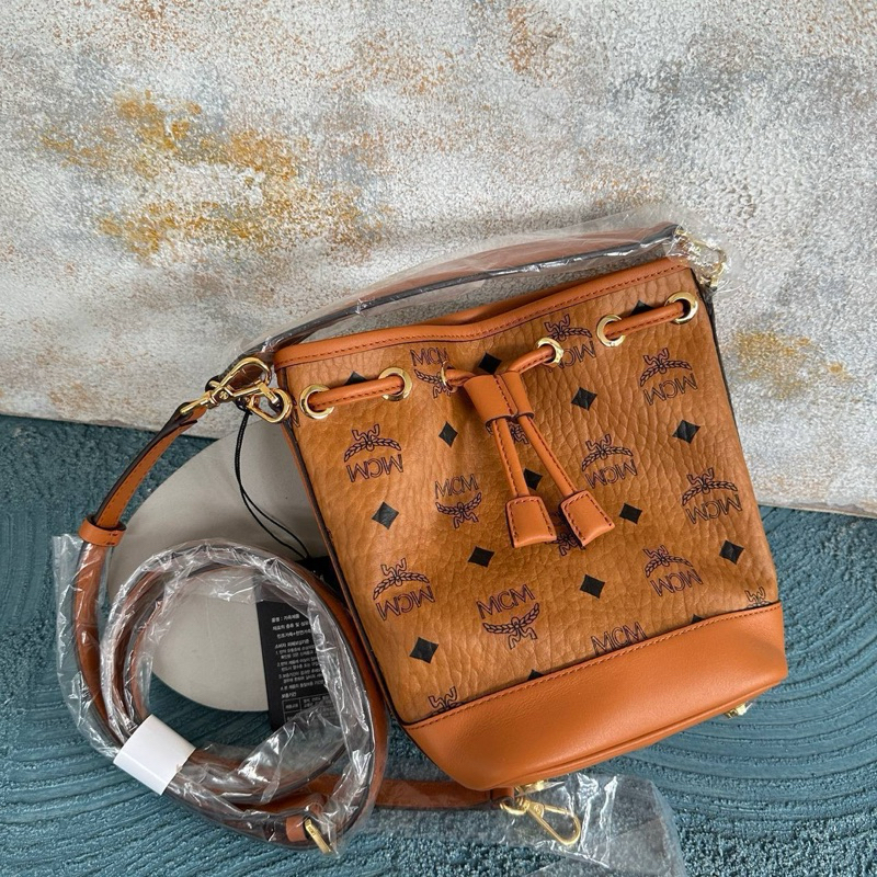MCM MINI DESSAU BUCKET BAG IN COGNAC
