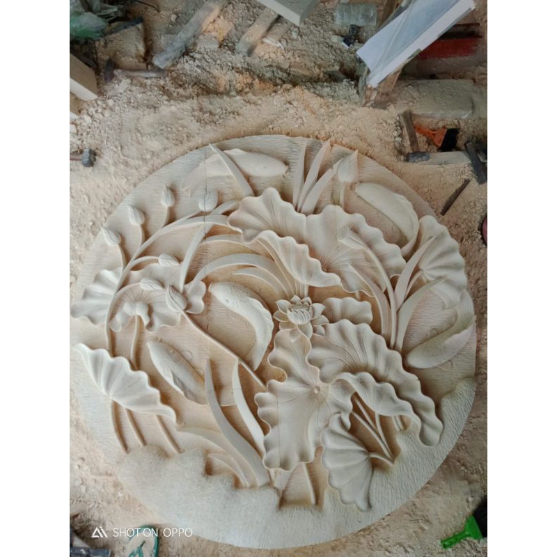 ukiran batu alam motif ikan koi