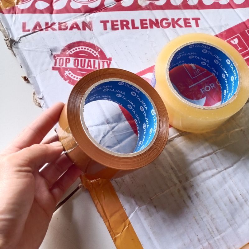 

Lakban Murah Ekonomis 100 Yard Lakban Coklat Bening 45 mm X 100 Yard Tajima Original Lakban
