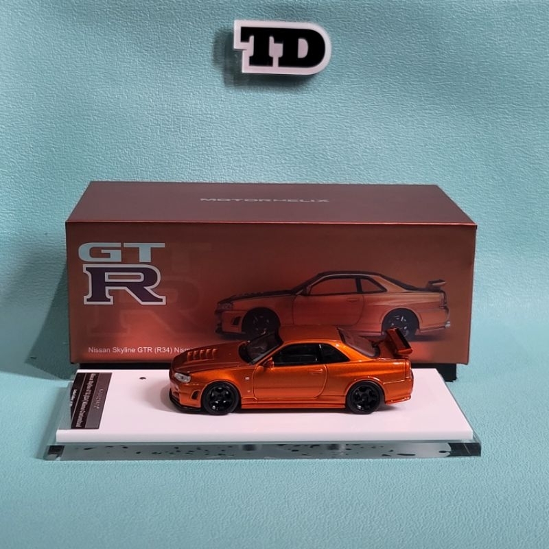Diecast 1:64 Motor Helix Nissan Skyline GTR (R34) Nismo Customized Version Metallic Orange